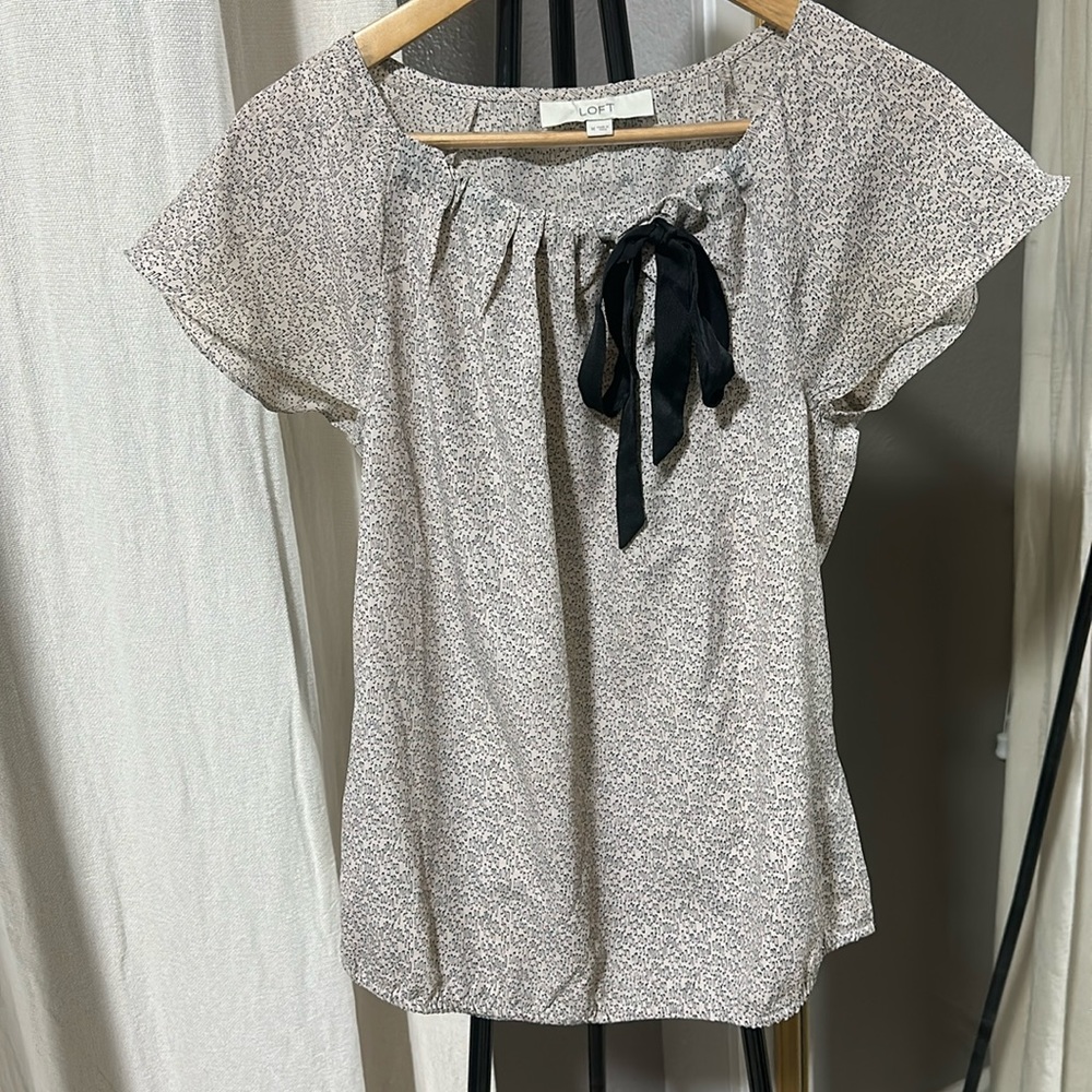 Ann Taylor- LOFT, sized M, is a more beige slight pink color